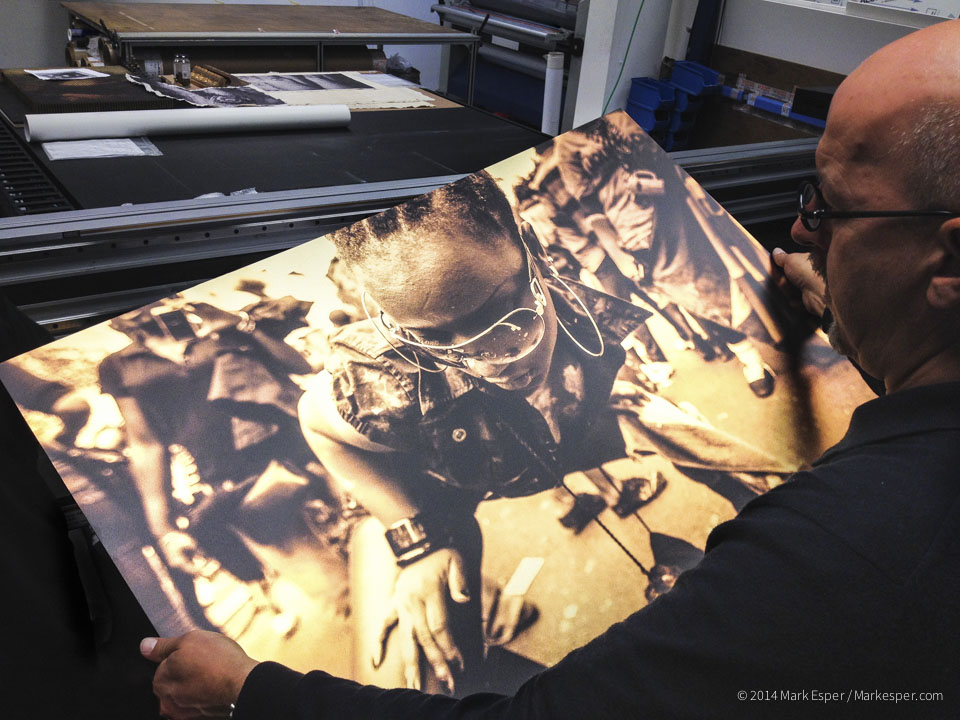 Mark Foxwell from Genesis Imaging inspecting a metal print from my Liquid Gold series